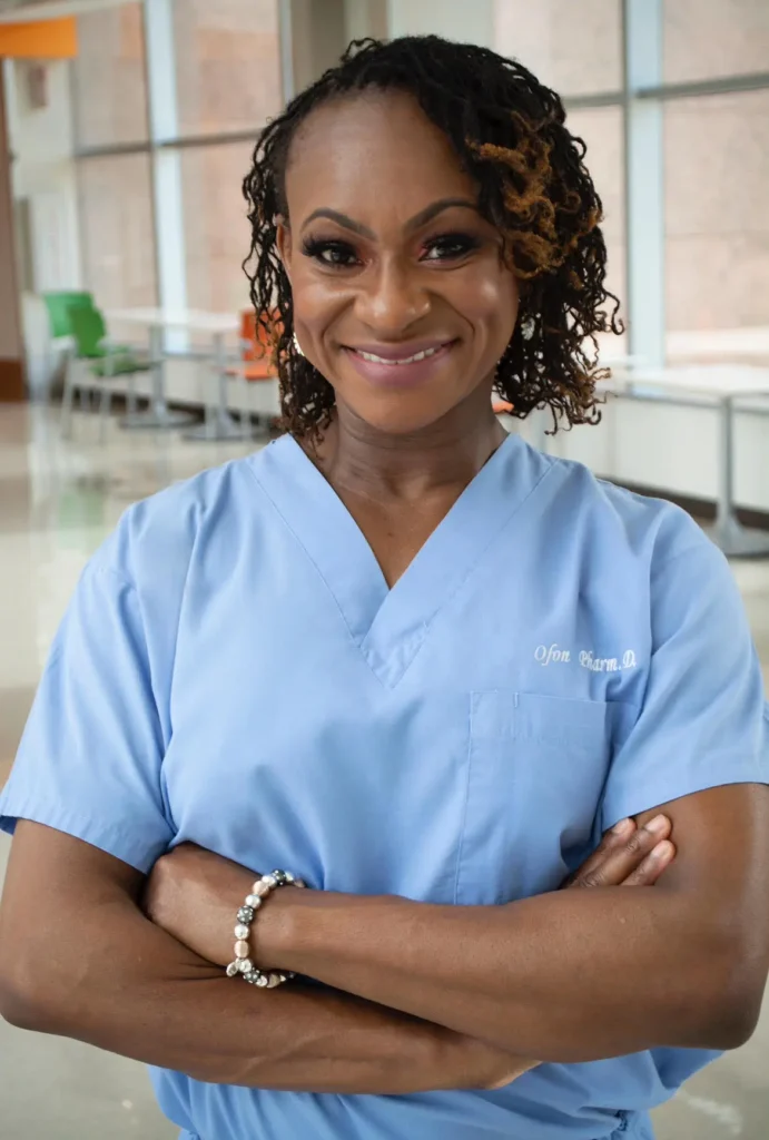 Smiling woman in blue scrubs